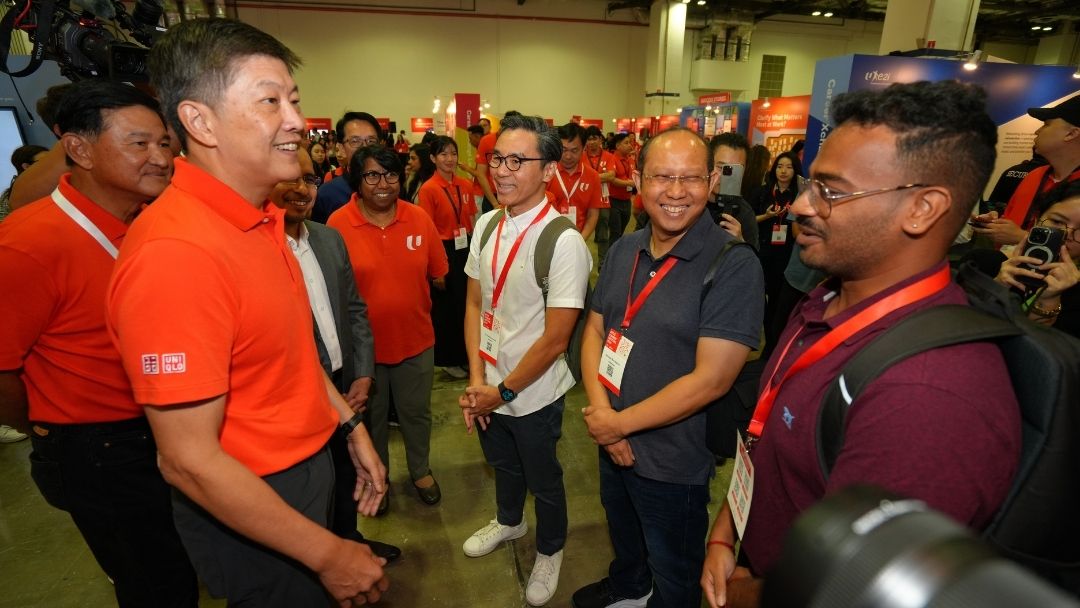 NTUC secretary-general Ng Chee Meng meeting jobseekers at NTUC Career Festival 2026, where the UTAP AI tool subsidy was launched