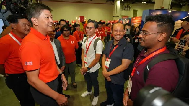 NTUC secretary-general Ng Chee Meng meeting jobseekers at NTUC Career Festival 2026, where the UTAP AI tool subsidy was launched