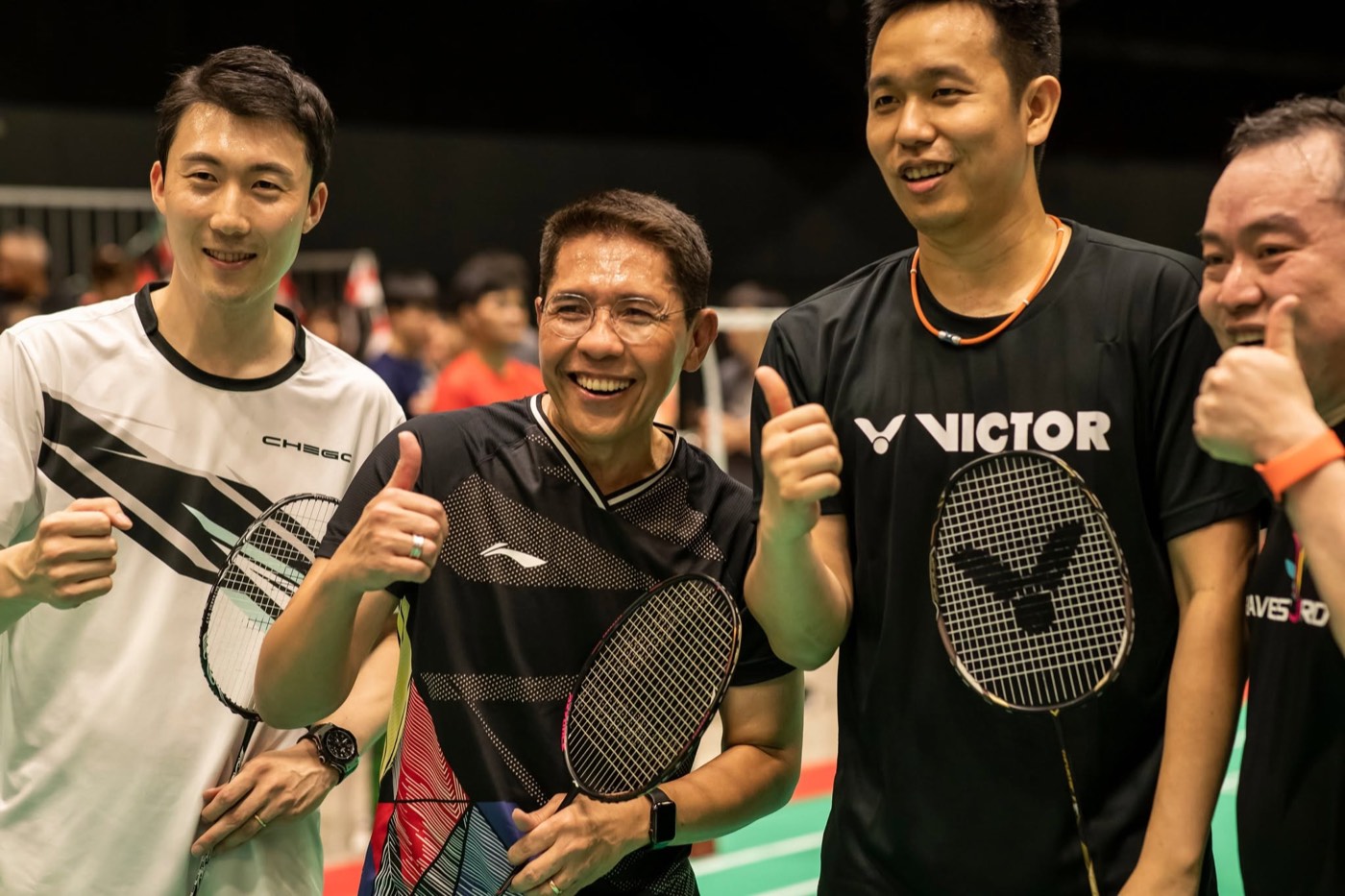 Dr Maliki Osman on court with players at the festival